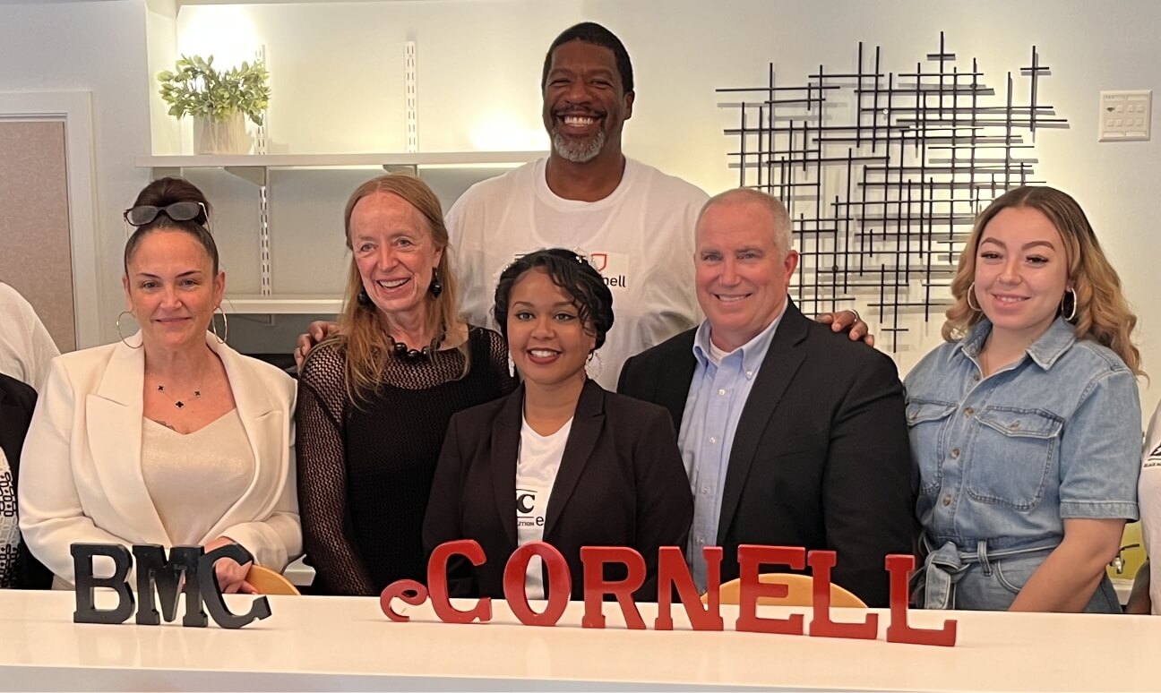 Ascendium Vice President of Communications and Community Engagement Brett Lindquist (second from right) poses with Black Men Coalition President Corey Marionneaux (center back), Diane Endres Ballweg (second from left) and Black Men Coalition staff.